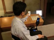 松下幸之助歴史館で、ロボット電動車いすやITツールを活用した障がい者支援の実証実験を実施