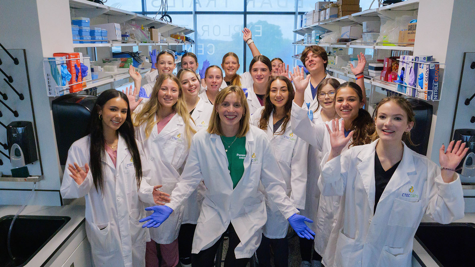 Katie Ledecky posing with students at the Cedar Trails Exploration Center’s Center for Advanced Professional Studies