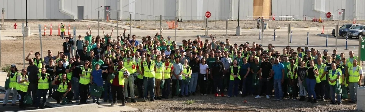 Group photo taken outside Panasonic’s battery factory