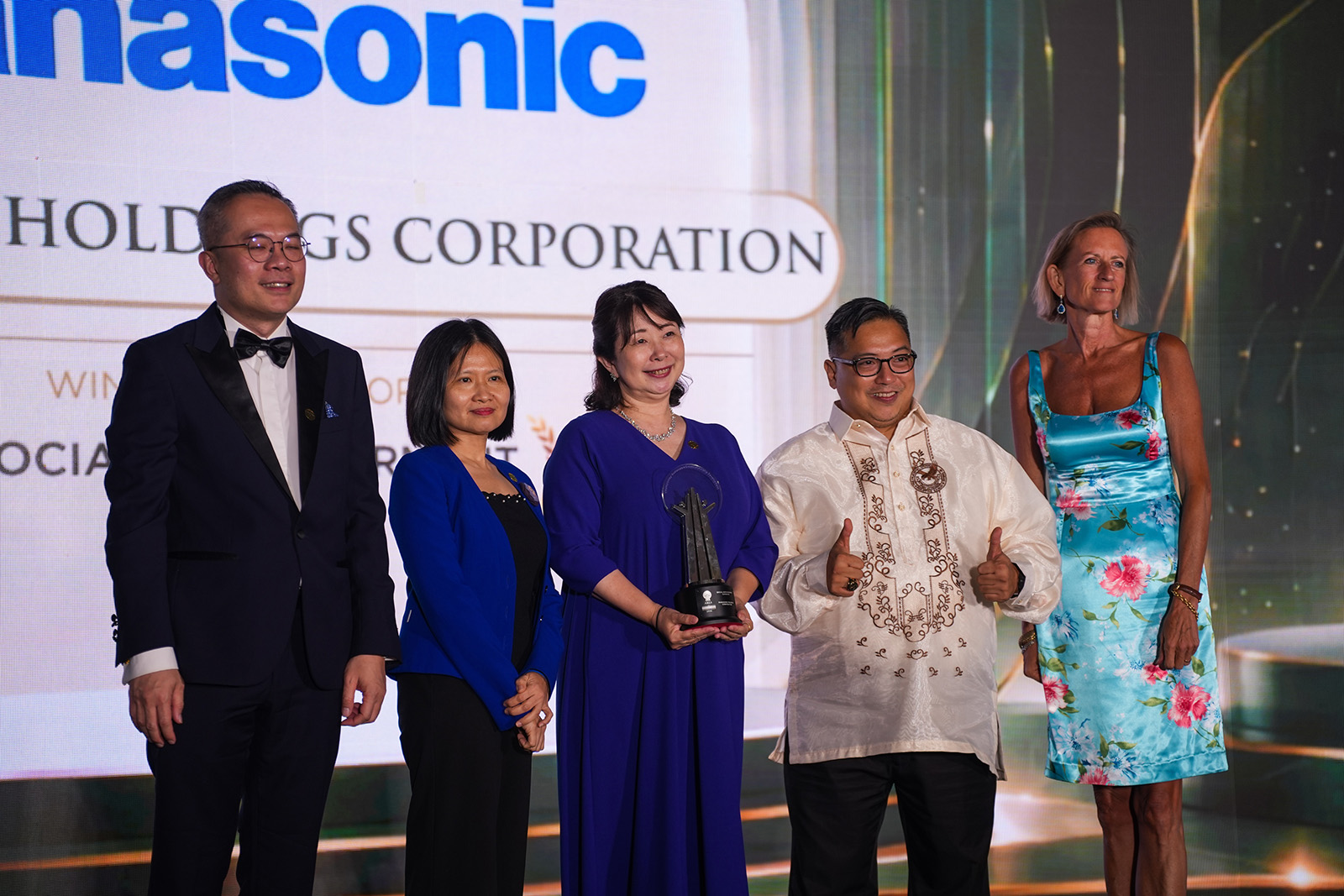 People pose with Panasonic’s award trophy at the Asia Responsible Enterprise Awards 2026.