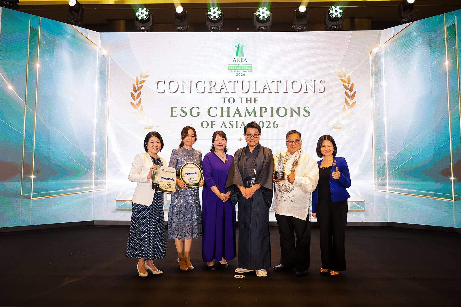 People pose with Panasonic’s awards at the Asia Responsible Enterprise Awards 2026.